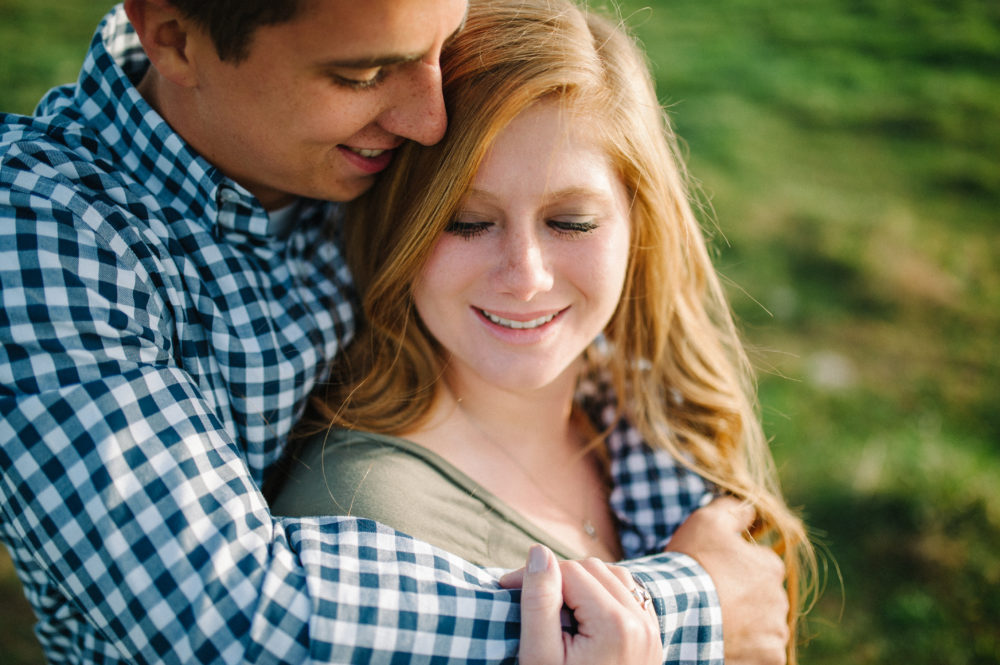 Iowa farm engagement shot by Stephanie Marie Photography with University of Northern Iowa graduates.