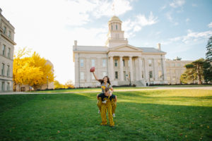 Old Capitol Building in Iowa City engagement Hawkeye football touchdown.