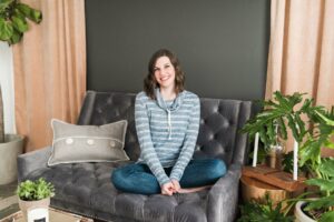 Women in casual attire sitting on couch for branding and headshot photography session