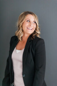 Kari realtor at Lepic-Kroeger Realtors posing for branding photography.