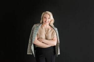 Professional headshot branding photography with professionally dressed women on black backdrop